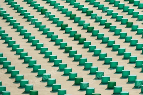 Preview: Cropped view of the concrete grey building wall elements with green plastic objects