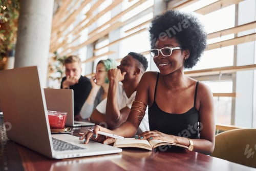 Preview: Black woman sitting in front of group of multi ethnic people with alternative girl with green hair