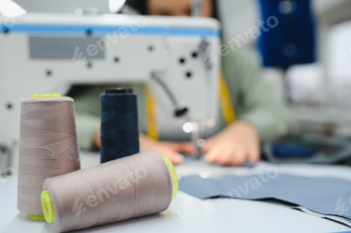 Preview: Seamstress at work. Dressmaker making clothes in modern studio.