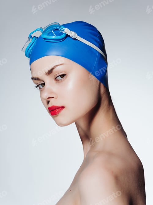 Preview: woman with bare shoulders swimming cap red lips posing sports