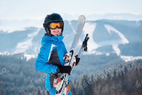 Preview: Skier resting on top of the mountain