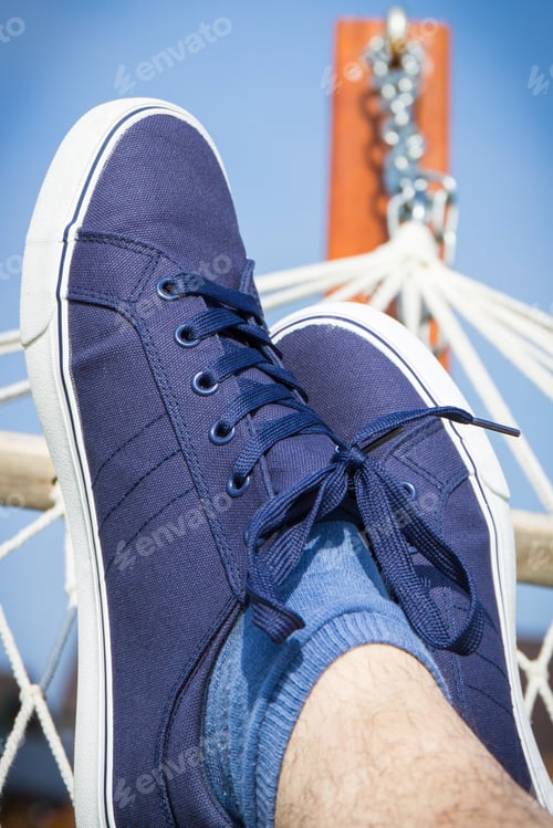Preview: Relaxing in hammock in summer garden