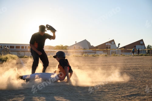 Preview: Youth baseball players sliding into base during game