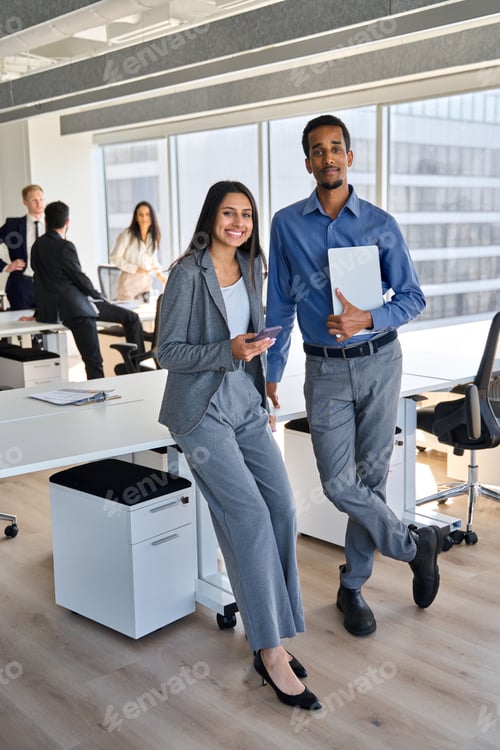 Preview: Happy diverse office workers standing in meeting room, vertical portrait.
