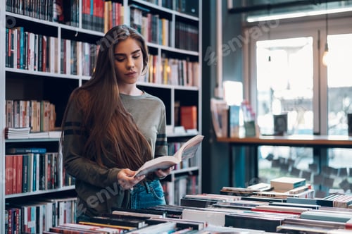 Preview: Woman buying books at a bookstore
