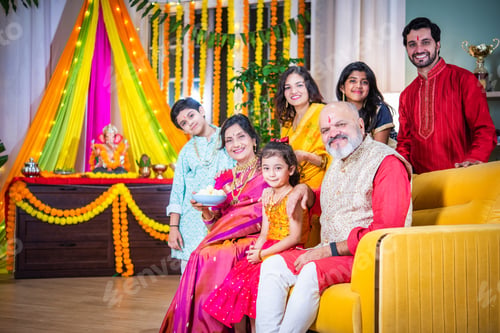 Preview: Indian festival Ganesh Utsav - family in traditional attire posing for group photo