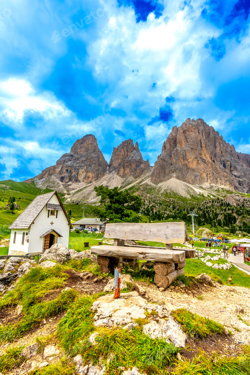 Preview: Wooden bench overlooking the majestic sella pass in the dolomites