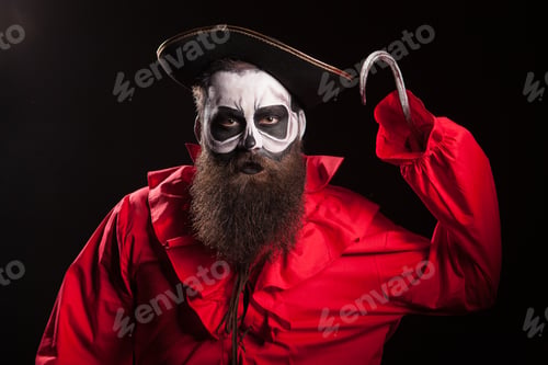 Preview: Crazy and dangerous pirate with a hook over black background