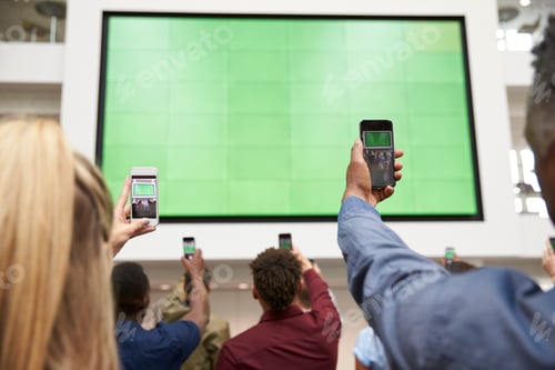 Preview: Students photograph screen with phones, back view, close up