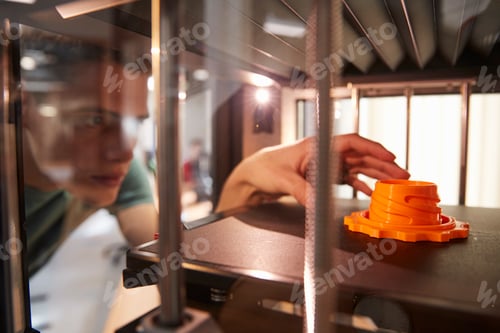 Preview: Male College Student Printing 3D Object In Design Lesson