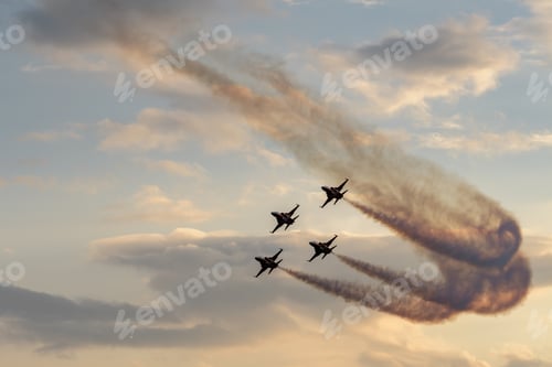 Preview: Air parade with military aircraft leaving dark trail flying in the bright sky with clouds