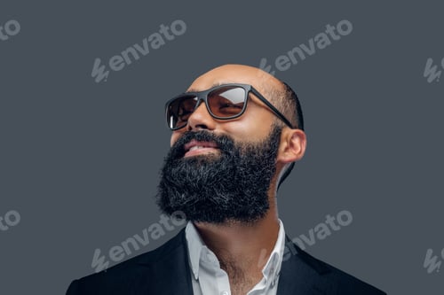 Preview: Bald head male dressed in a suit and sunglasses.