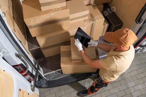 Preview: Delivery Driver Uses Tablet Inside Cargo Van