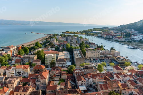 Preview: Aerial view of cityscape Omis surrounded by buildings and Cetina river