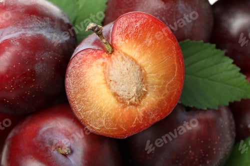 Preview: Tasty plums all over background, close up