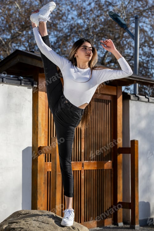 Preview: A young athlete standing on with one leg