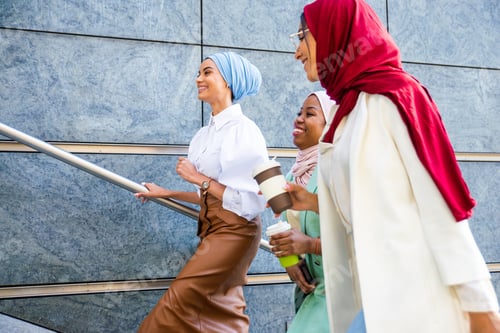 Preview: Beautiful muslim girl wearing hijab bonding outdoors