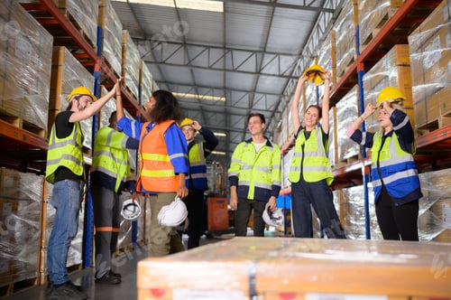 Preview: Portrait of worker in an auto parts warehouse, Encourage each other after completing tasks