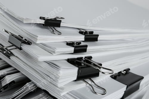 Preview: Pile of documents with binder clips, closeup