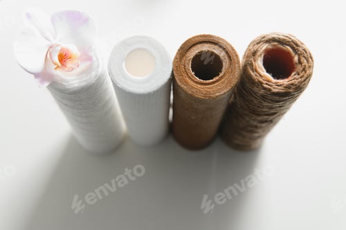 Preview: used water filters, glasses with dirty water