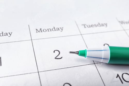 Preview: Pen on calendar page, closeup. Planning concept
