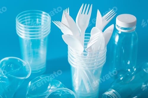 Preview: single use plastic cups, forks, spoons. concept of recycling plastic, plastic waste