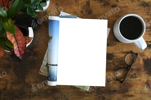 Vista previa: An open magazine laying on a table or desk with a white blank page for mock up.