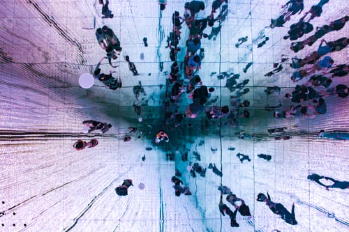 Preview: Low angle view of ceiling mirror showing people's reflection