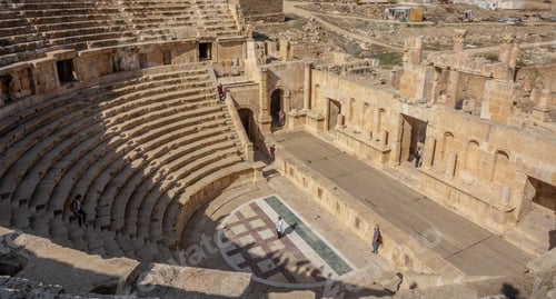 Preview: High angle shot of two people standing in an ancient amphitheater during daytime