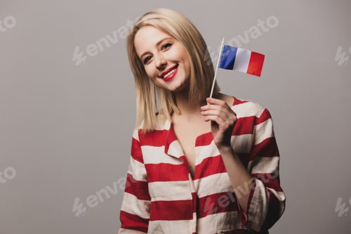 Preview: girl holds french flag on gray background