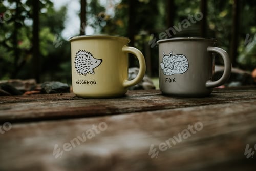 Preview: Two cups of coffee with a printed hedgehog and a fox in the nature