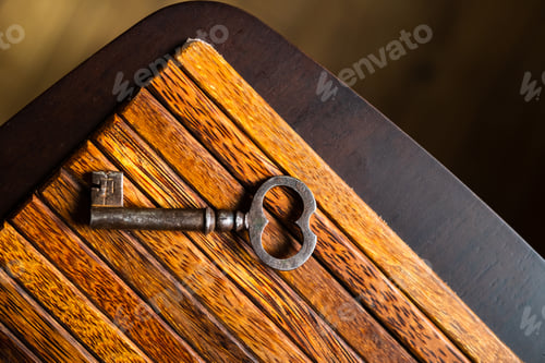 Preview: the old key lies on an old wooden table, natural textures, the concept of discoveries, secrets