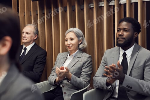 Preview: Business participants in anticipation of speaker