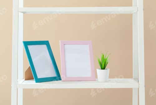 Preview: White bookshelf with plant in pot against beige background
