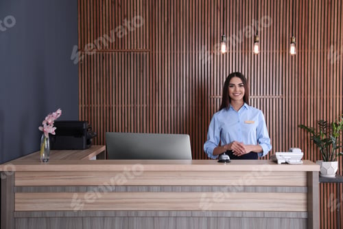 Preview: Portrait of receptionist at desk in lobby