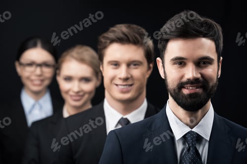 Preview: group of smiling business people standing in row isolated on black