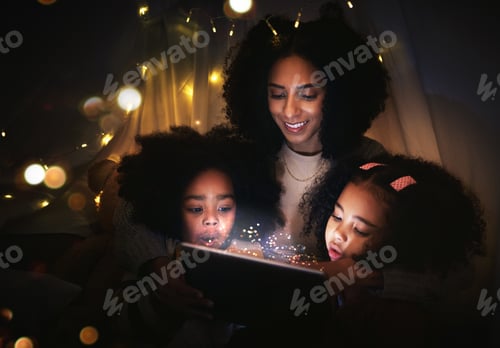 Preview: Tablet, night a mother reading to her kids in a tent while camping in the bedroom of their home tog