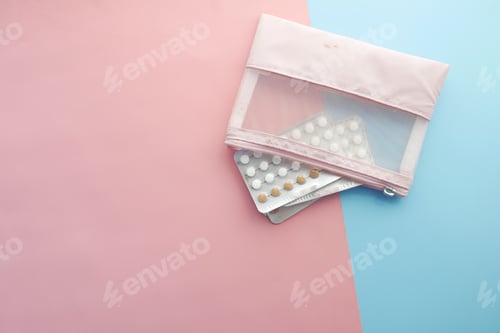 Preview: birth control pills on wooden background, close up