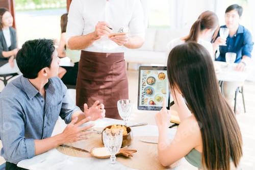 Preview: Engaging Service at the Eatery, Clients Enjoying Conversations while Waitstaff Attend