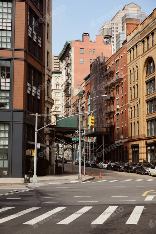 Preview: new york street with modern and vintage buildings near traffic intersection with pedestrian crossing