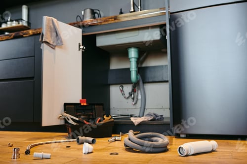 Preview: Open door of cabinet under sink in the kitchen