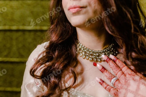 Preview: a woman with some tattoos on and jewelry around her neck