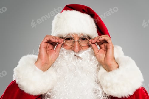 Preview: Portrait of santa claus wearing eyeglasses isolated on grey