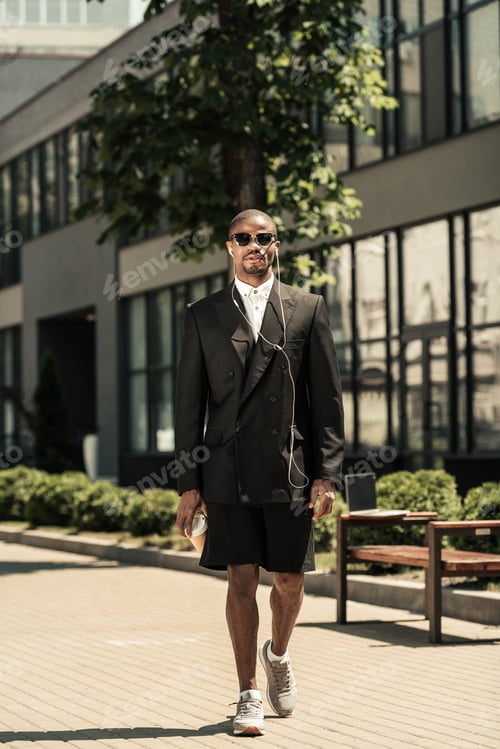 Preview: Man in Blazer Walking in the City