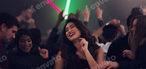 Preview: Dancing her way into 2020. Cropped shot of an attractive young woman dancing in a nightclub.