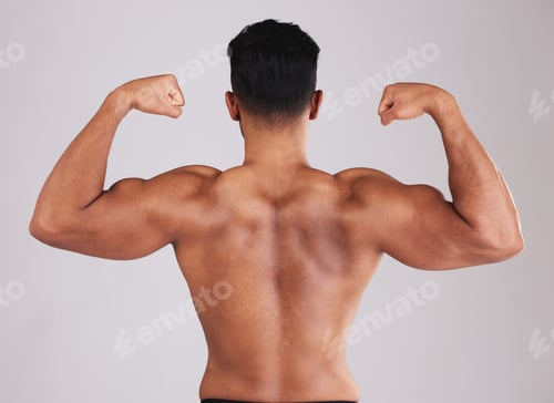 Preview: Fitness, back muscle flexing and man isolated on gray studio background. Wellness, sports and body