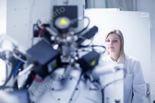 Preview: Female scientist using scanning electron microscope in lab