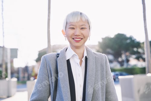 Preview: Chinese Businesswoman with Short White Hair, Business Attire, Smiling at the Camera