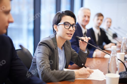 Preview: Young Businesswoman Speaking at Conference