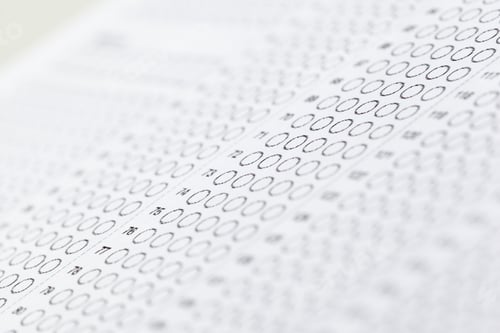 Preview: Wrapper filled with empty bubbles on an answer sheet during a testing time